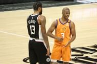 Chris Paul #3 of the Phoenix Suns argues a Suns foul with Paul George #13 of the LA Clippers during the second half of game three of the Western Conference Finals at Staples Center on June 24, 2021 in Los Angeles, California.